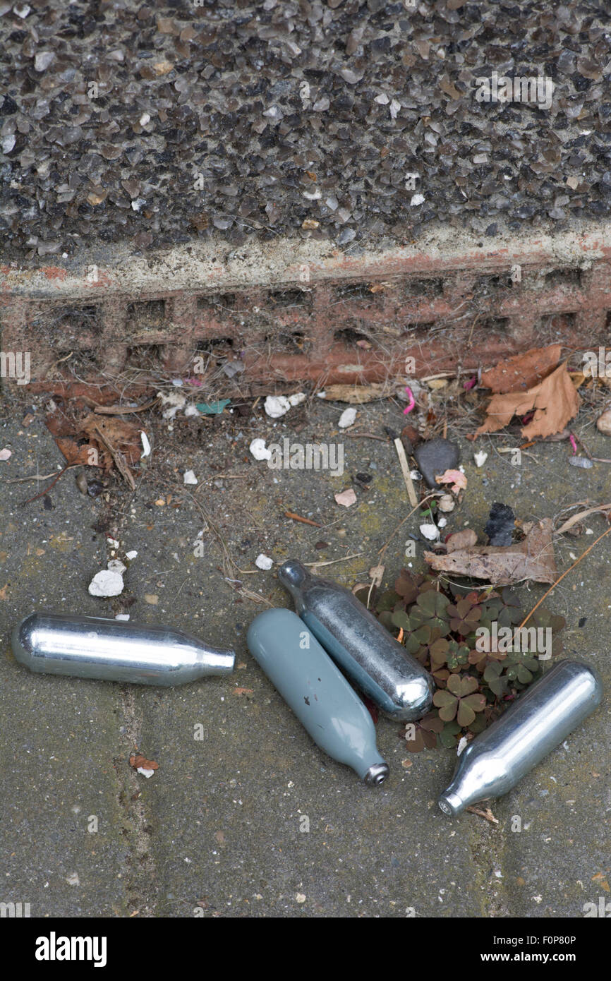 Small cylinders of Nitrous Oxide (Laughing Gas) used by some people as a legal high. Stock Photo