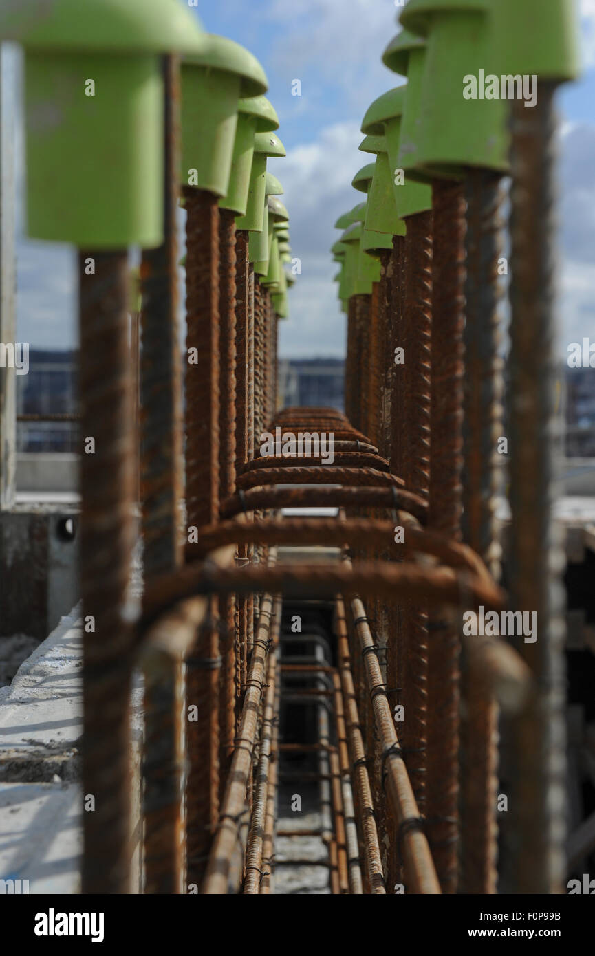 Plastic Rebar Caps on building sites to protect from sharp metal work Stock Photo