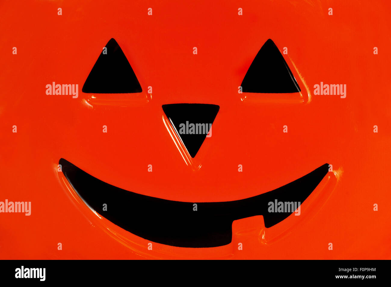 Macro shot of a pumpkin face decoration depicting halloween Stock Photo