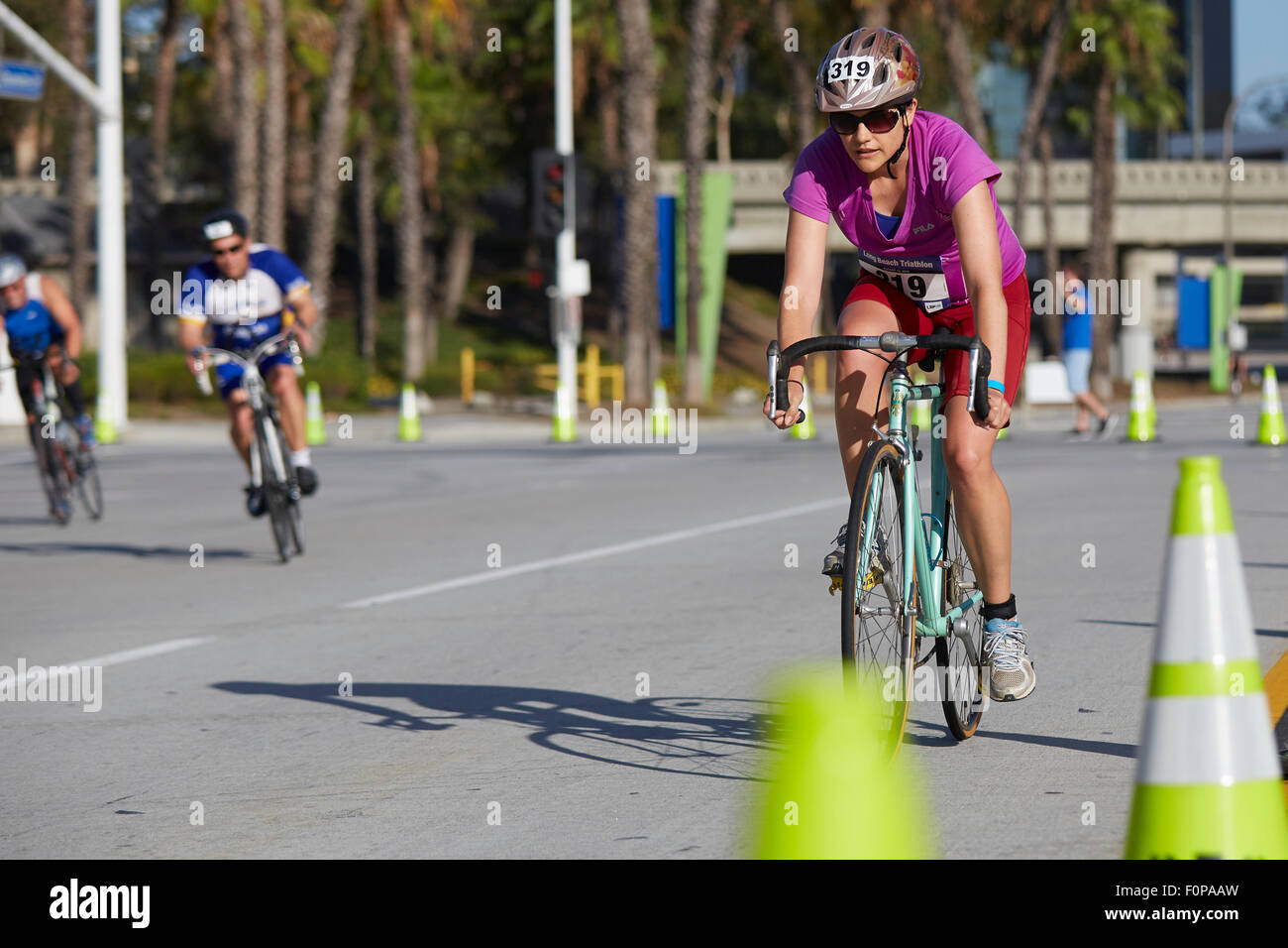 Determined Female Cyclist Competing In The Long Beach Triathlon. 16