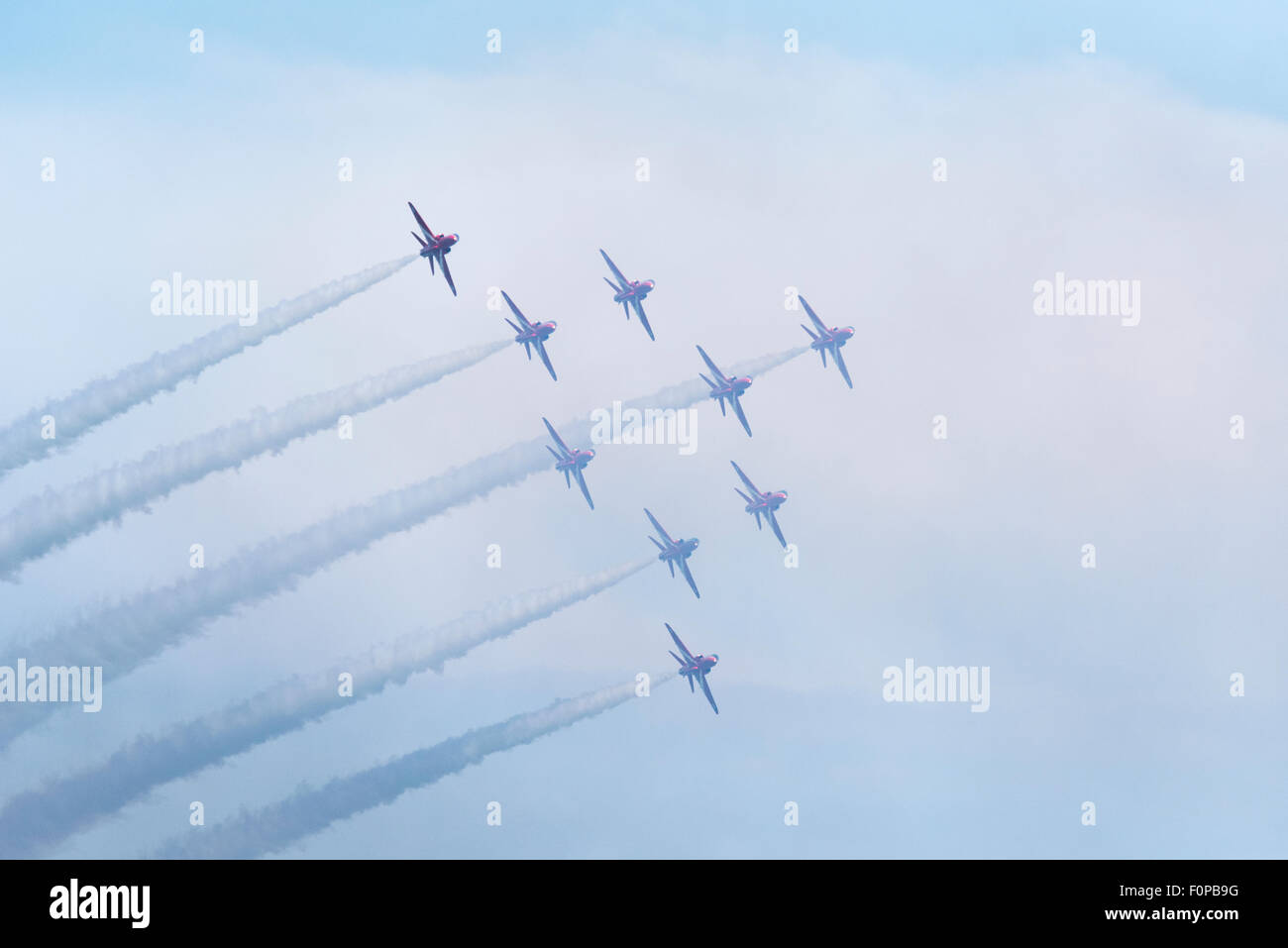 All nine Red Arrows in formation and releasing smoke at Airbourne ...