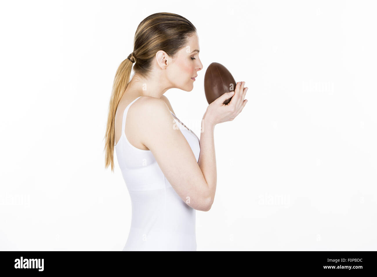 woman holding  chocolate easter egg Stock Photo
