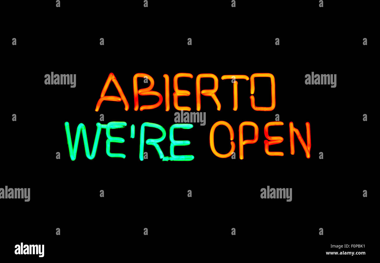 EnglishSpanish open neon sign Stock Photo Alamy