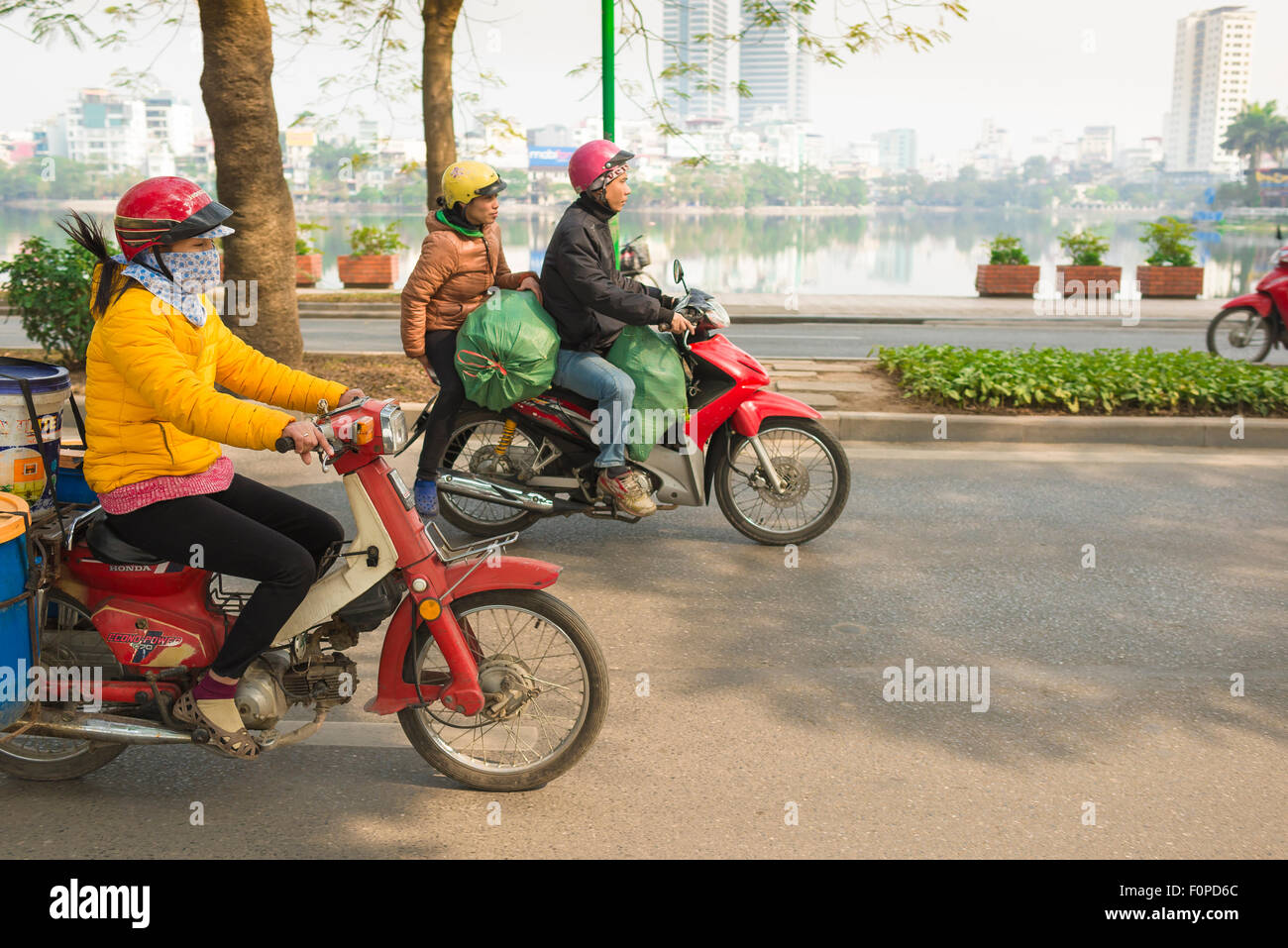 Vietnamese Motorcycle Rider Hanoi Vietnam traffic, view of vietnamese people on motorcycles riding ...