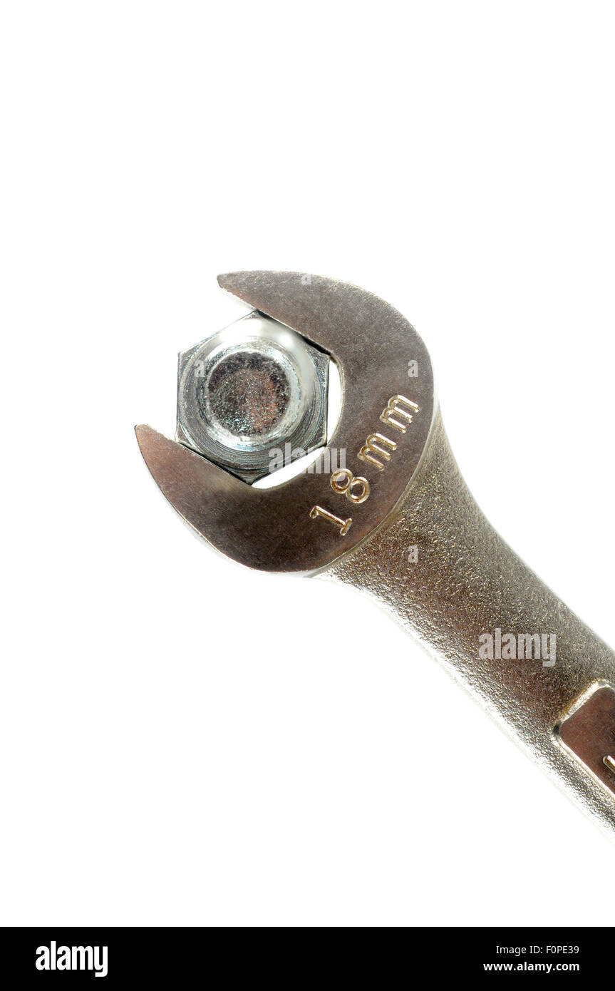 Macro shot of a bolt and a wrench isolated on white Stock Photo
