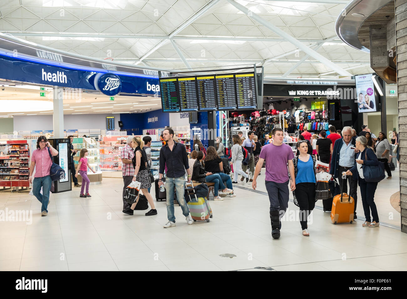 Boots,shop,store,Passengers,travellers with luggage and shops,currency  exchange outlets at Departures Terminal at Stansted Airport,London,U.K  Stock Photo - Alamy