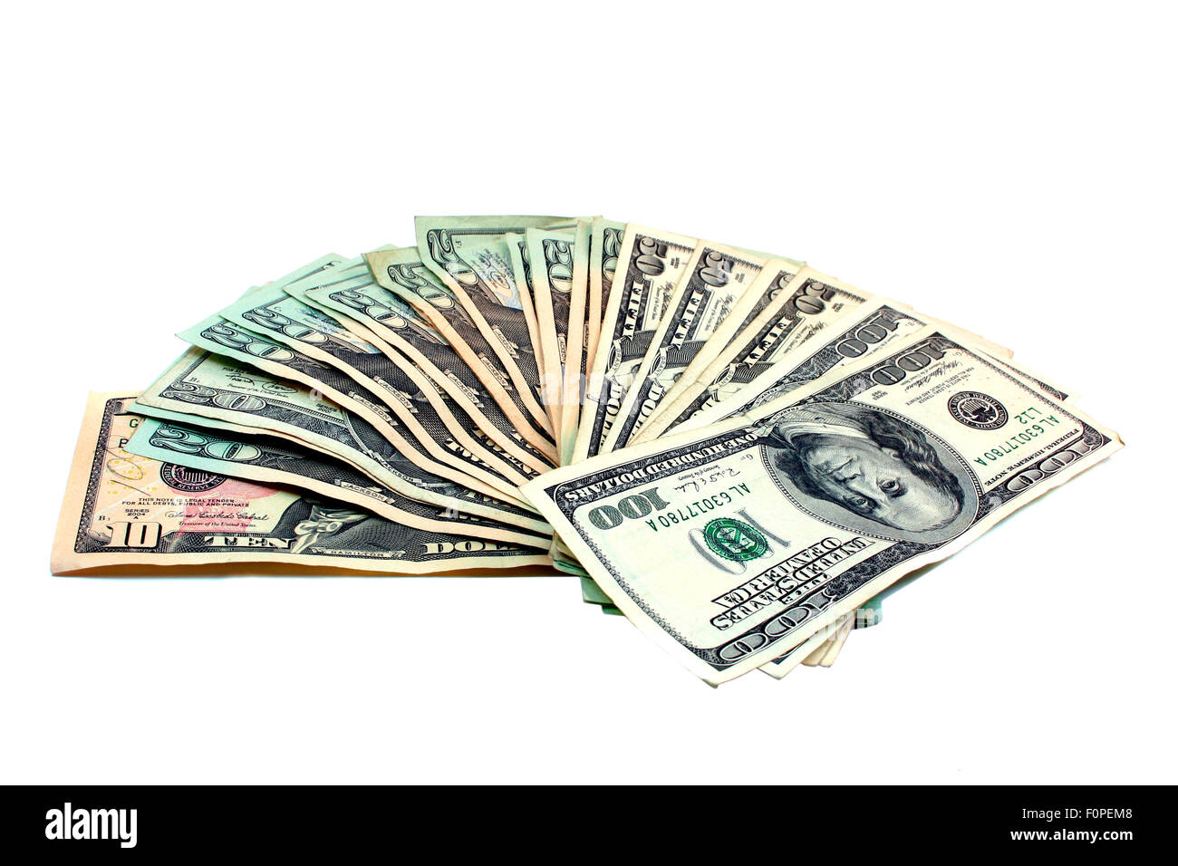 A collection of different denominations dollar bills isolated on white