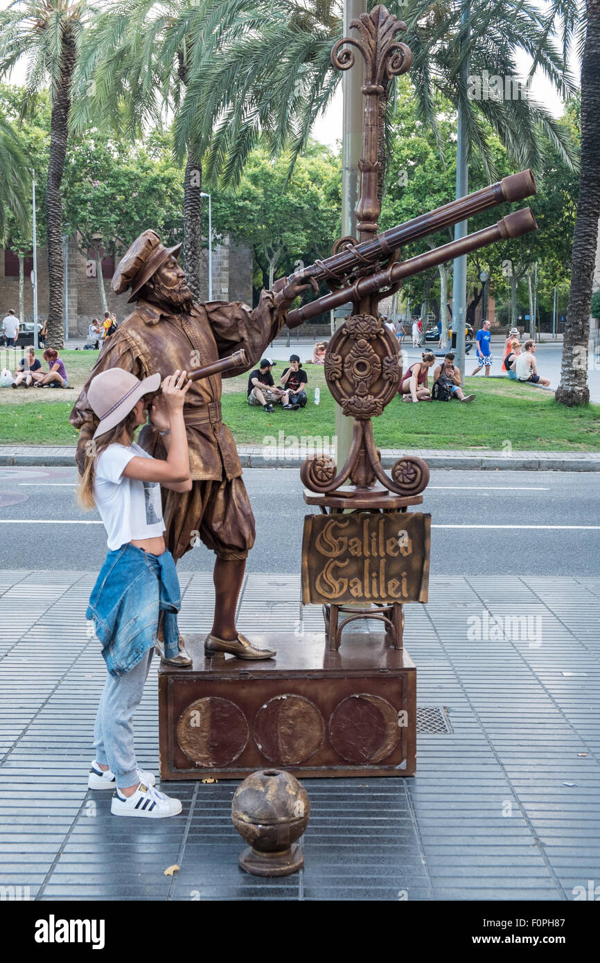 Tourist pose with human statue street entertainer,busker,entertainers along La Rambla,La Ramblas, street, Barcelona,Catalan, Catalonia,Spain.Spanish. Stock Photo