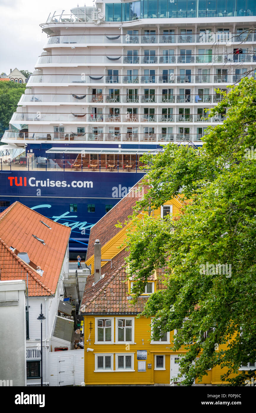 TUI cruise ship Mein Schiff in port of Stavanger, Norway and traditional wood paneled houses. Stock Photo