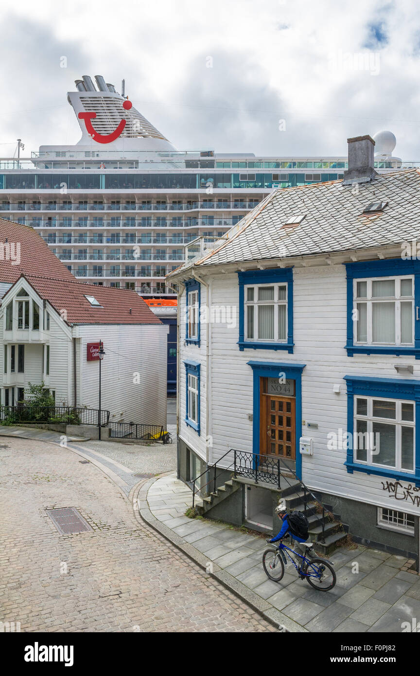 TUI cruise ship Mein Schiff in port of Stavanger, Norway and traditional wood paneled houses. Stock Photo