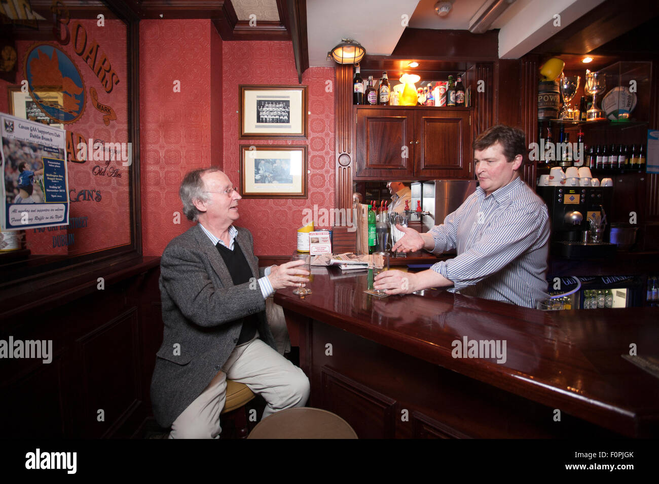Publican and local man inside the Boar's Head Pub, Capel Street, Dublin, Republic of Ireland Stock Photo