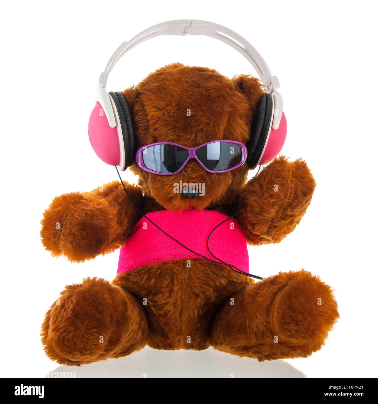 Funny stuffed bear with head phone isolated over white background Stock