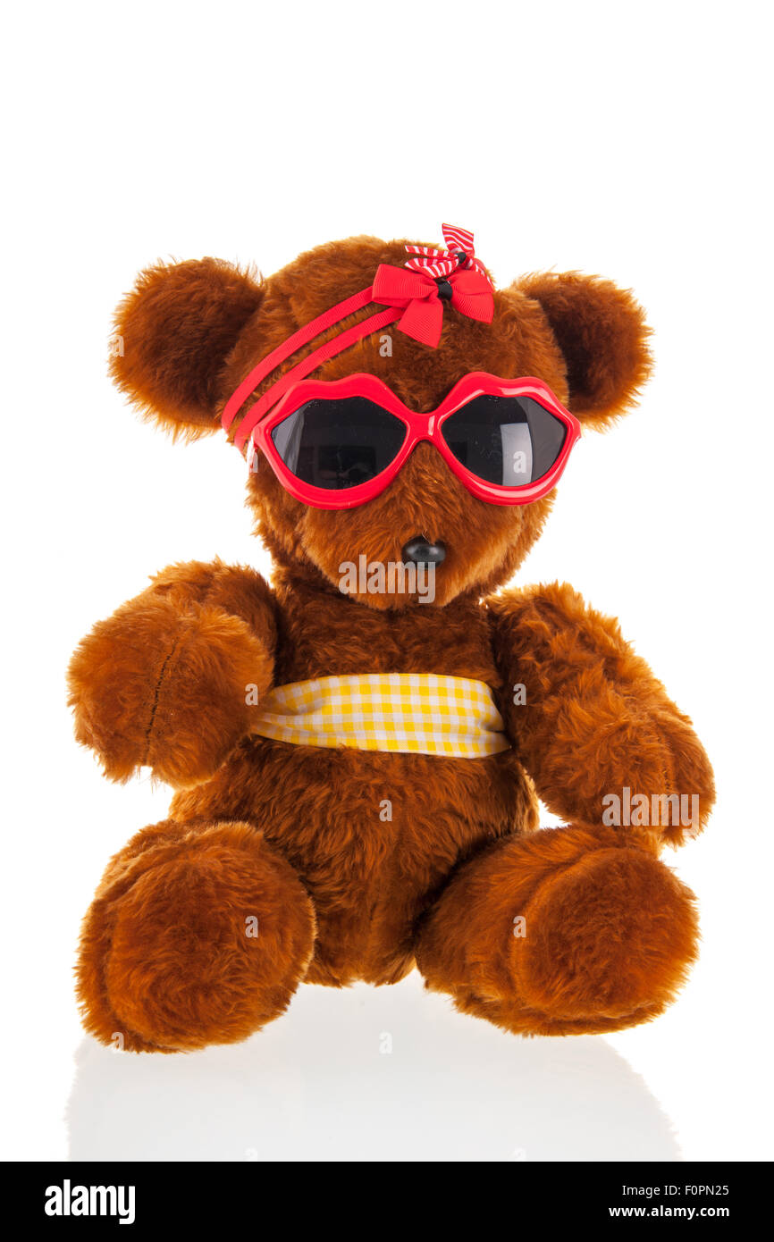 Funny stuffed bear with sunglasses isolated over white background Stock