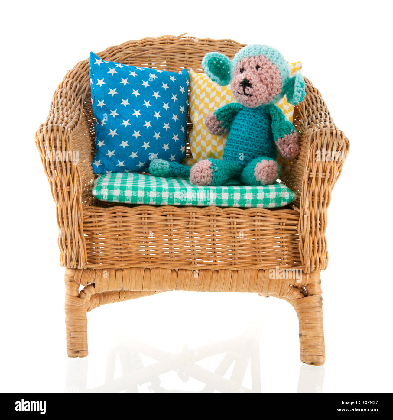Wicker chair with colorful pillows Stock Photo Alamy