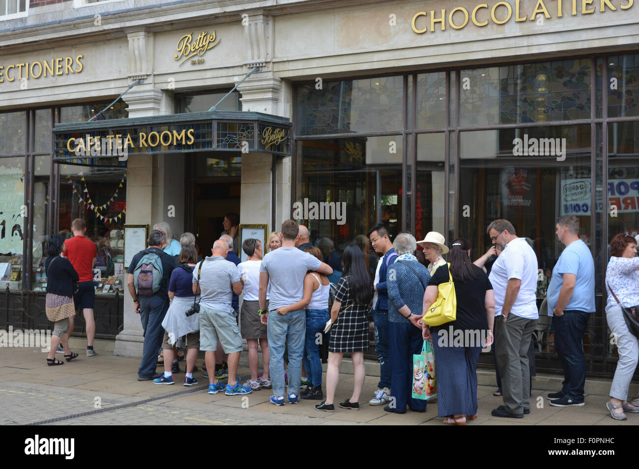 Queue outside Betty's Cafe and Tea Rooms, York, Yorkshire, England. Stock Photo