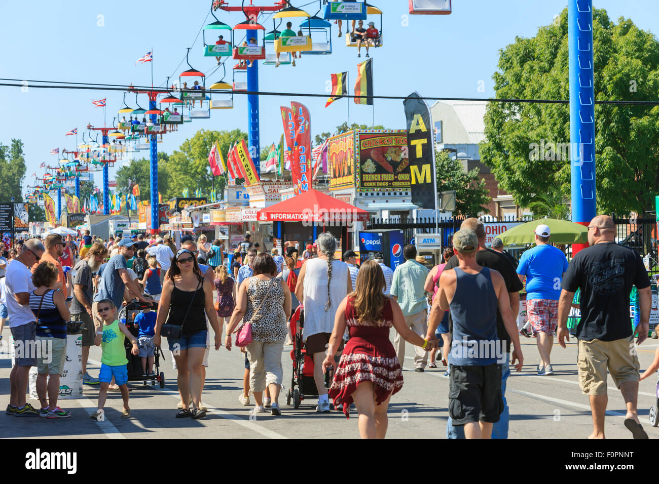 A large crowd walks on the midway at the Ohio State Fair in Columbus, Ohio. Stock Photo