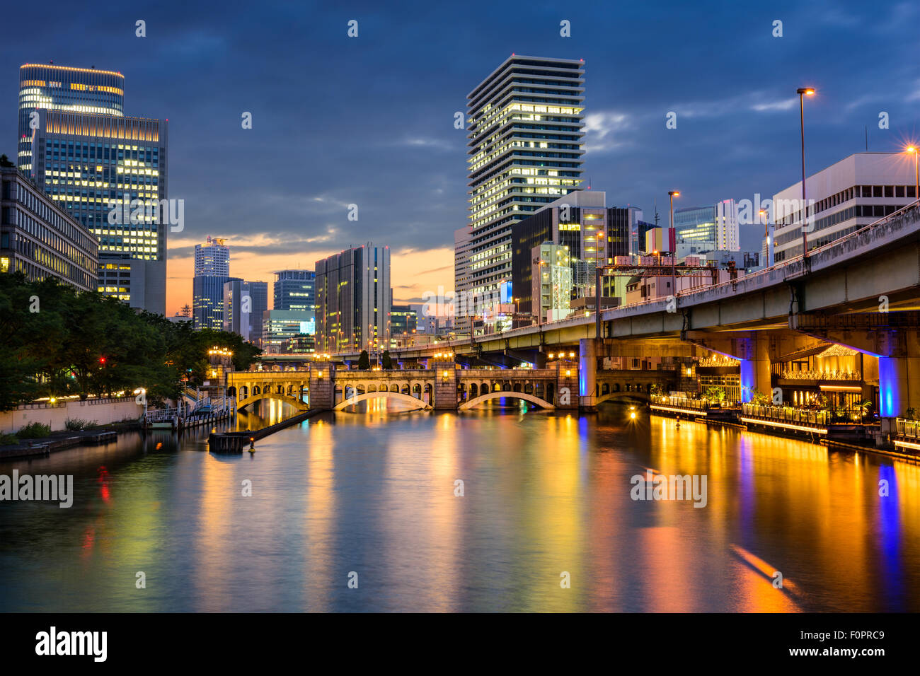 Osaka, Japan skyline over the Dojima river in the Nakanoshima district ...