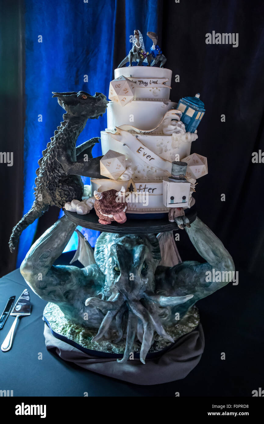 Strange custom-designed, fully edible wedding cake for a nerdy geek wedding including Cthulhu,dragons, dinosaurs, and more! Stock Photo