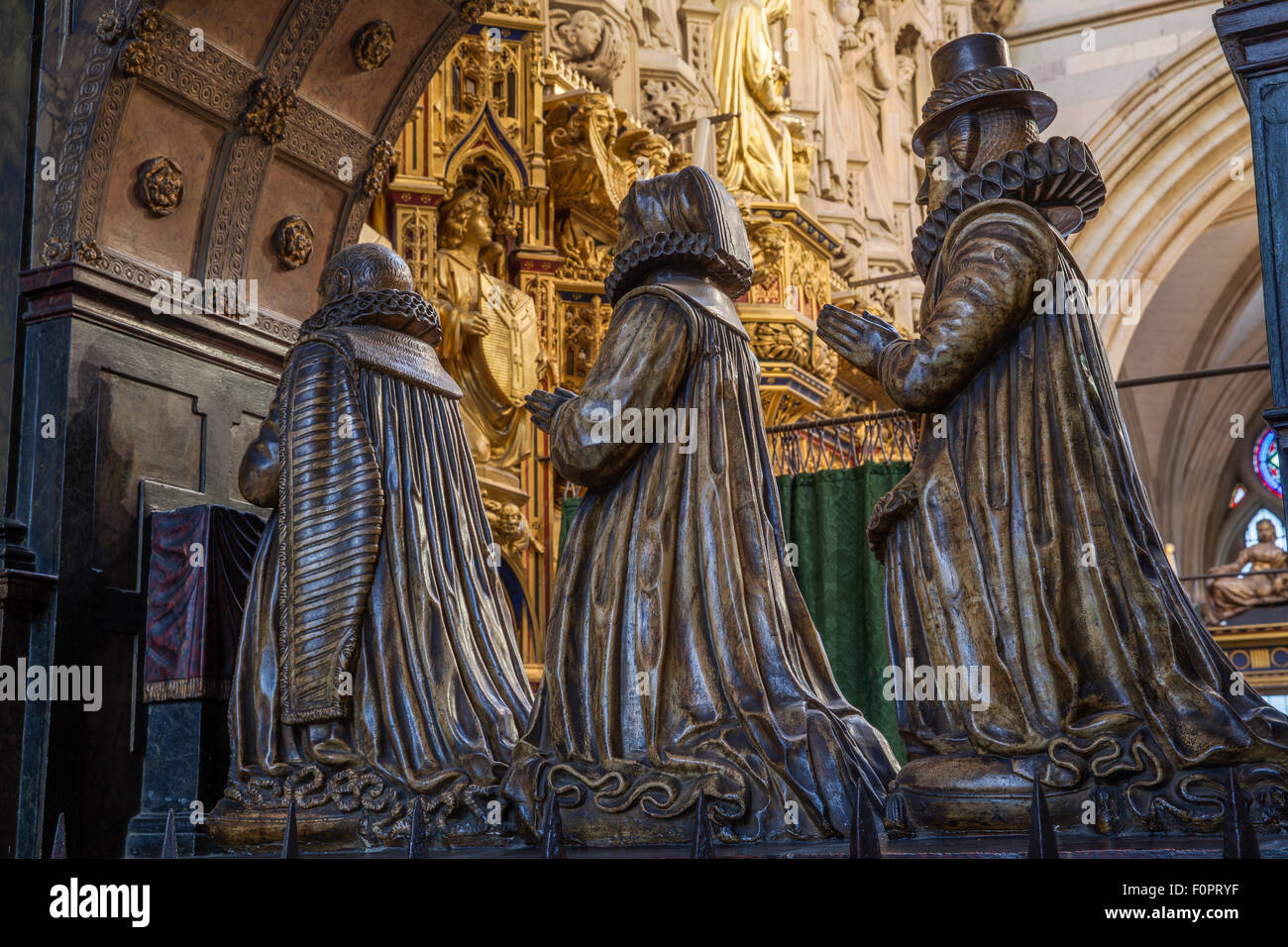 Statue of an alderman and his two wives portrayed kneeling in prayer in Southwark Cathedral in London Stock Photo