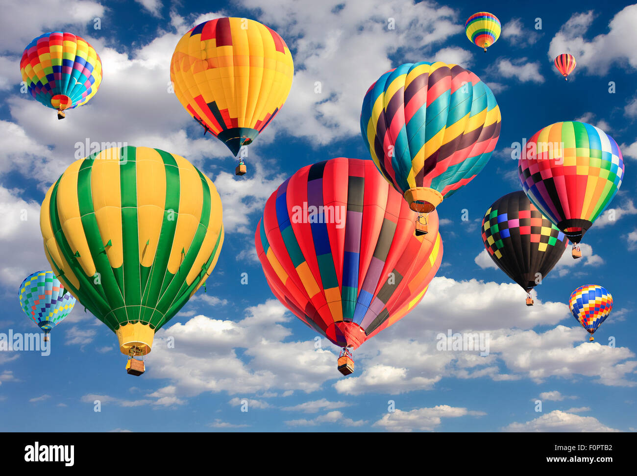 Multicolored hot air balloons flying Stock Photo