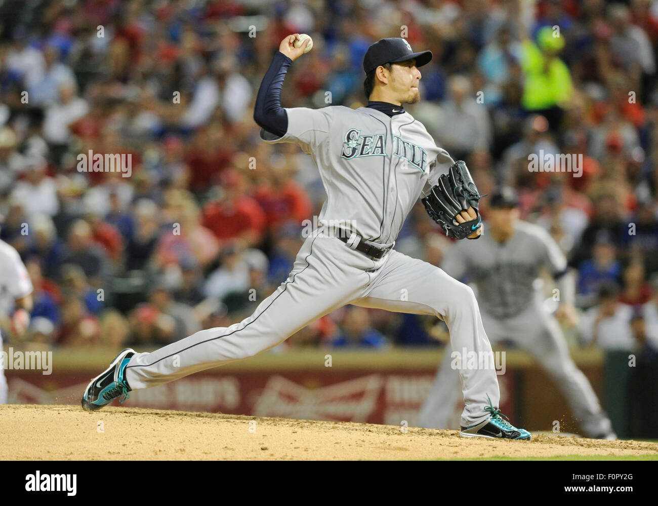 AUG 18, 2015: Seattle Mariners starting pitcher Hisashi Iwakuma #18 during an MLB game between the Seattle Mariners and the Texas Rangers at Globe Life Park in Arlington, TX Seattle defeated Texas 3-2 Albert Pena/CSM Stock Photo