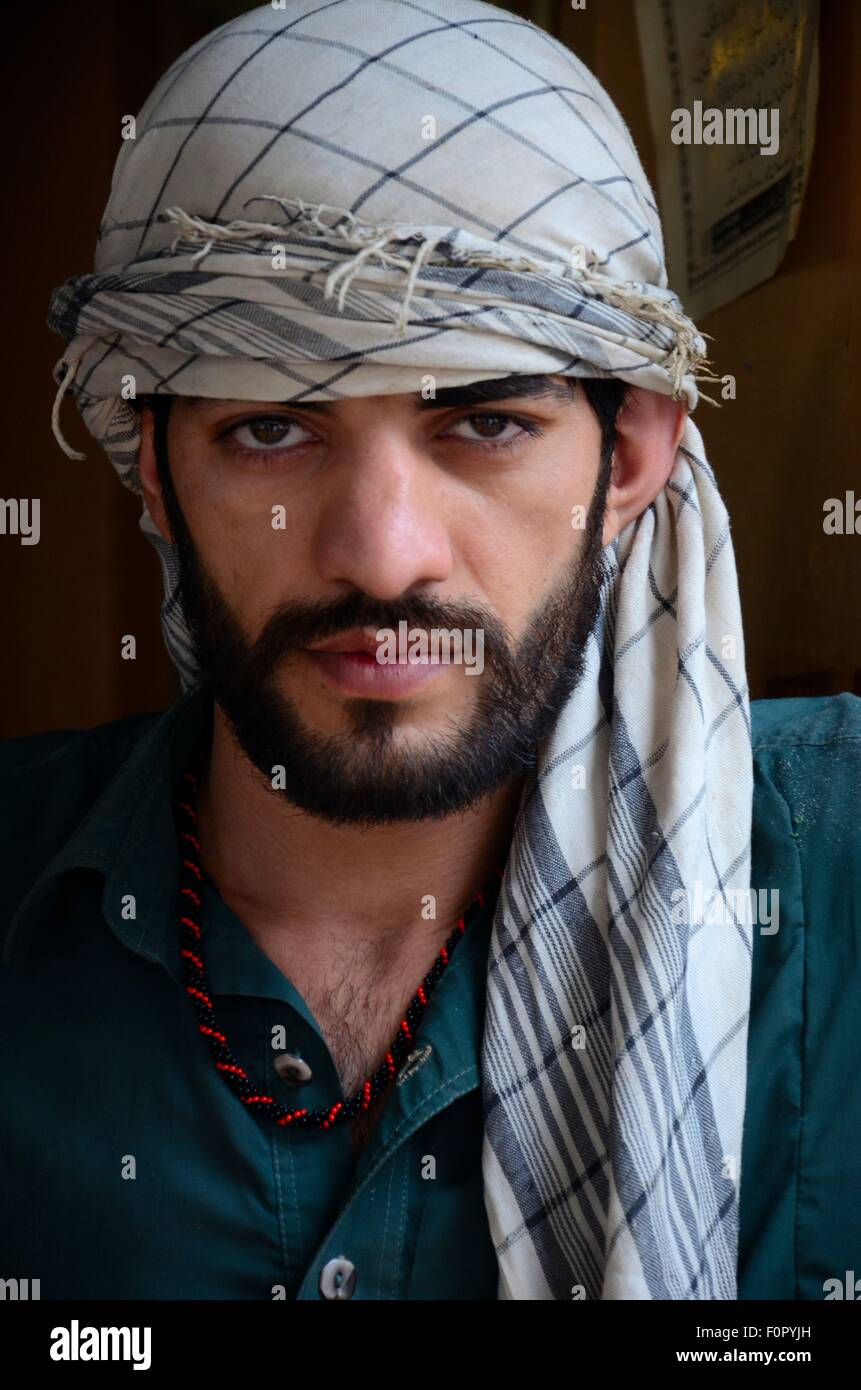 Pakistani Pashtun man models with headscarf and necklace Peshawar Pakistan Stock Photo