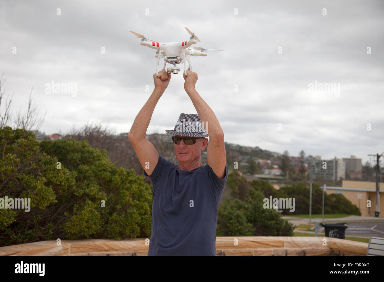 Drone camera being caught as it lands Stock Photo - Alamy