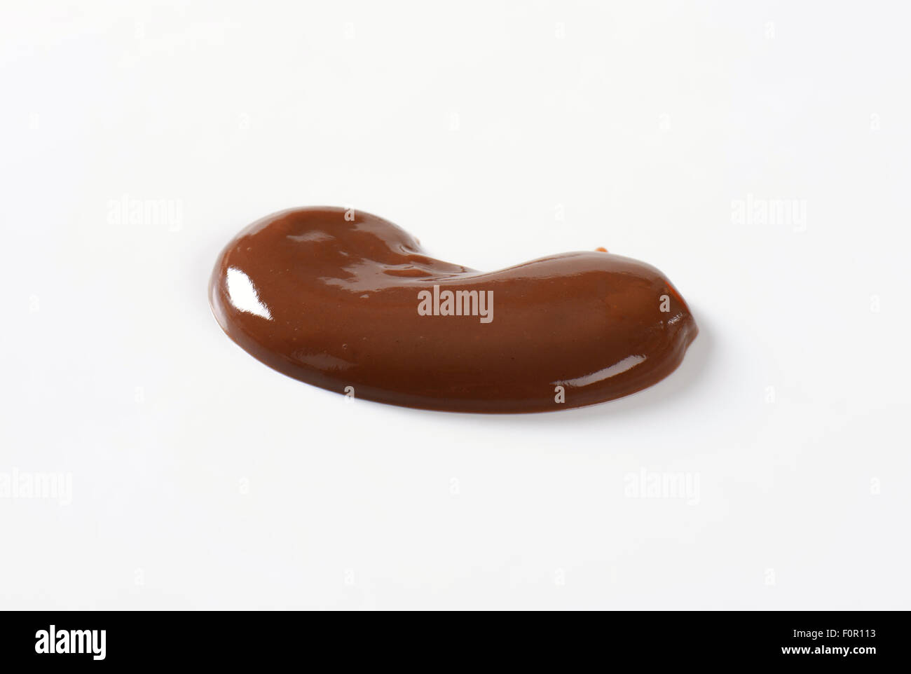 blob of chocolate pudding on white background Stock Photo