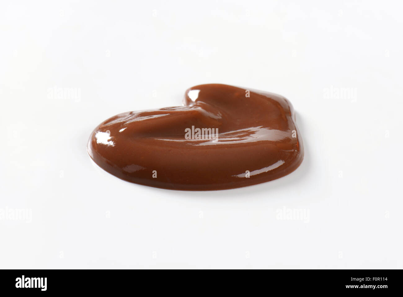 blob of chocolate pudding on white background Stock Photo