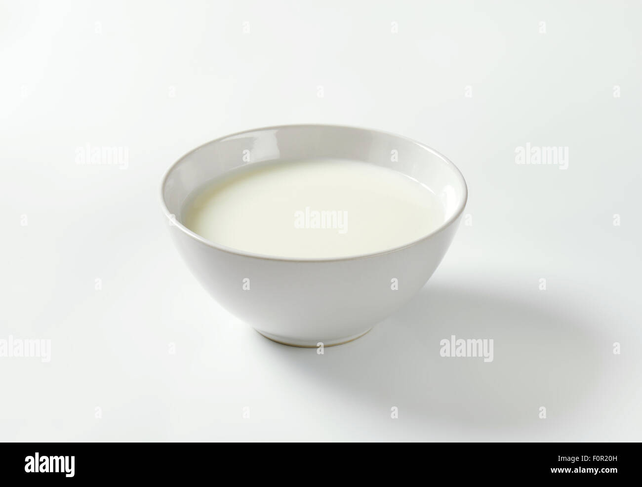 bowl of milk on white background Stock Photo