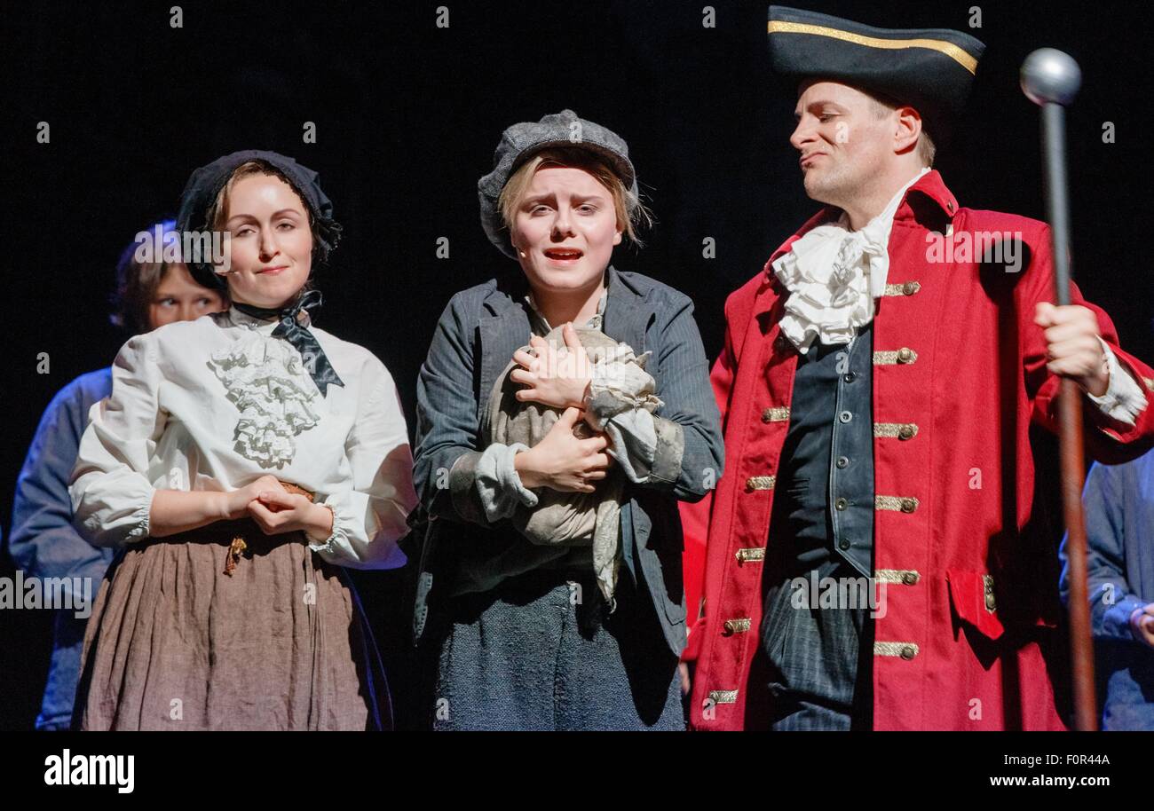 Hamburg, Germany. 19th Aug, 2015. Actresses Alexandra Kurzeja (front row l-r), Carolin Waltsgott as 'Oliver Twist' and actor Steve Alex perform on stage during the photo rehearsal for the family musical 'Oliver Twist' in Hamburg, Germany, 19 August 2015. The musical premieres on 22 August 2015 in the Harburger theatre. Photo: Markus Scholz/dpa/Alamy Live News Stock Photo