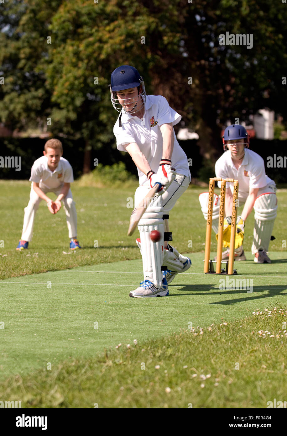 Secondary school pupils playing cricket, Surrey, UK Stock Photo