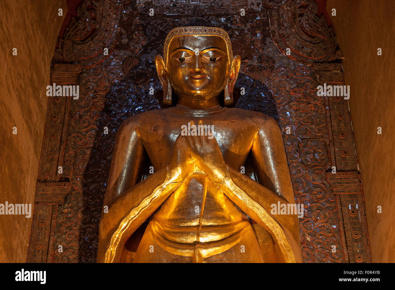 Gilded Buddha statue, Ananda Temple, Bagan, Mandalay Division, Myanmar Stock Photo