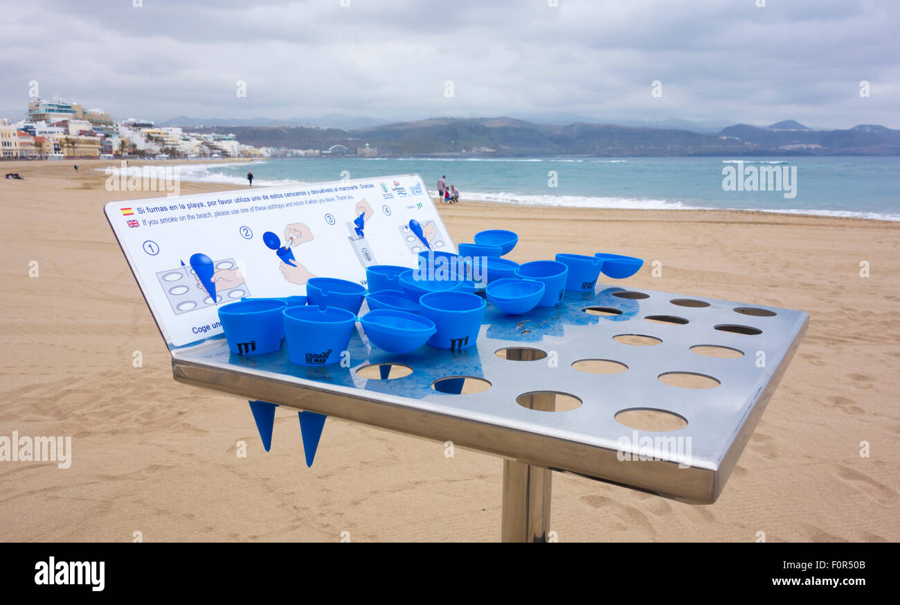 Plastic cones with lids supplied by local council for beach users to use as ashtrays to dispose of cigarette butts Stock Photo