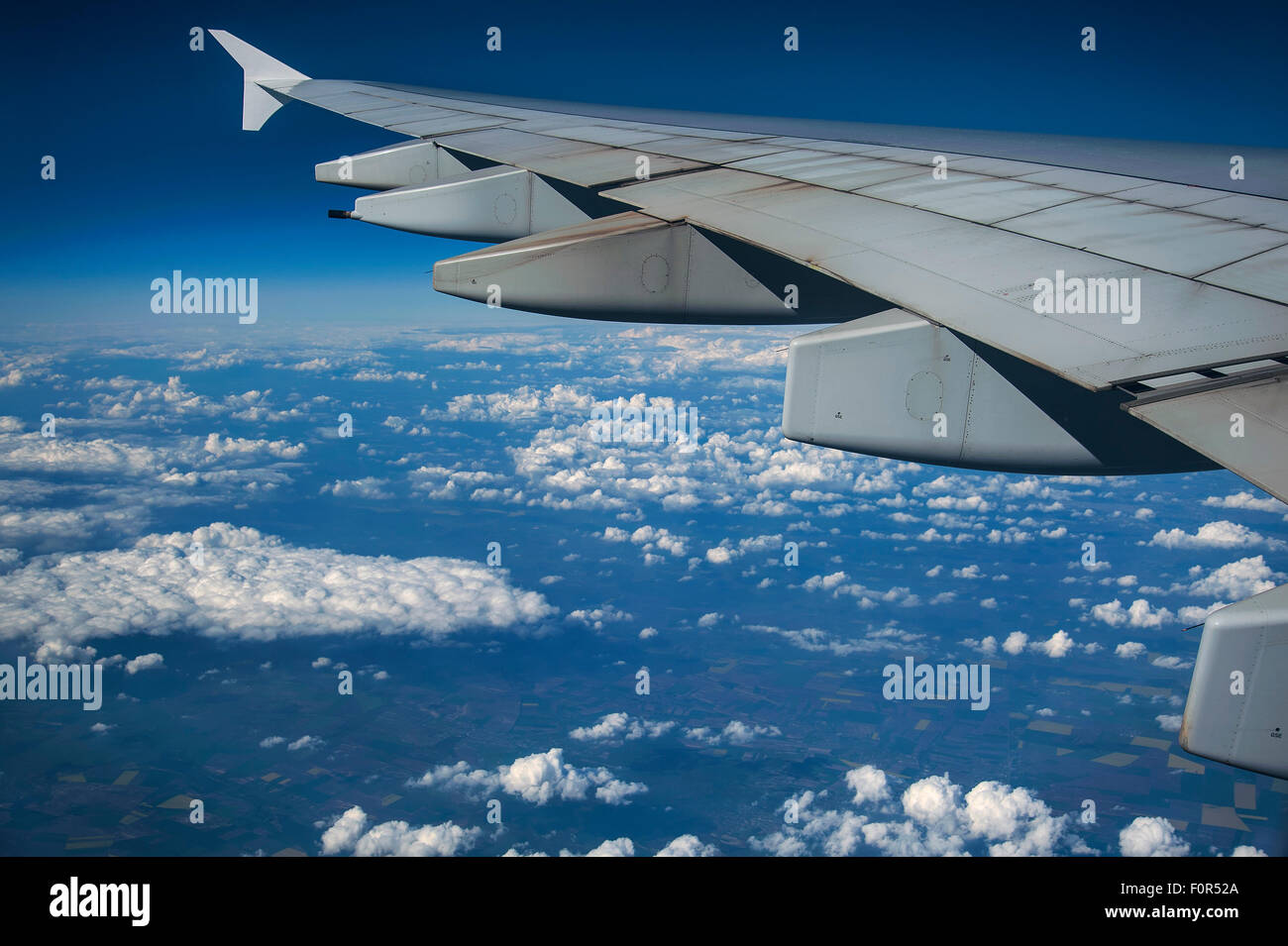 Wing of an Airbus A380-800, flying above the clouds, cumulus clouds, near Frankfurt, Hesse, Germany Stock Photo
