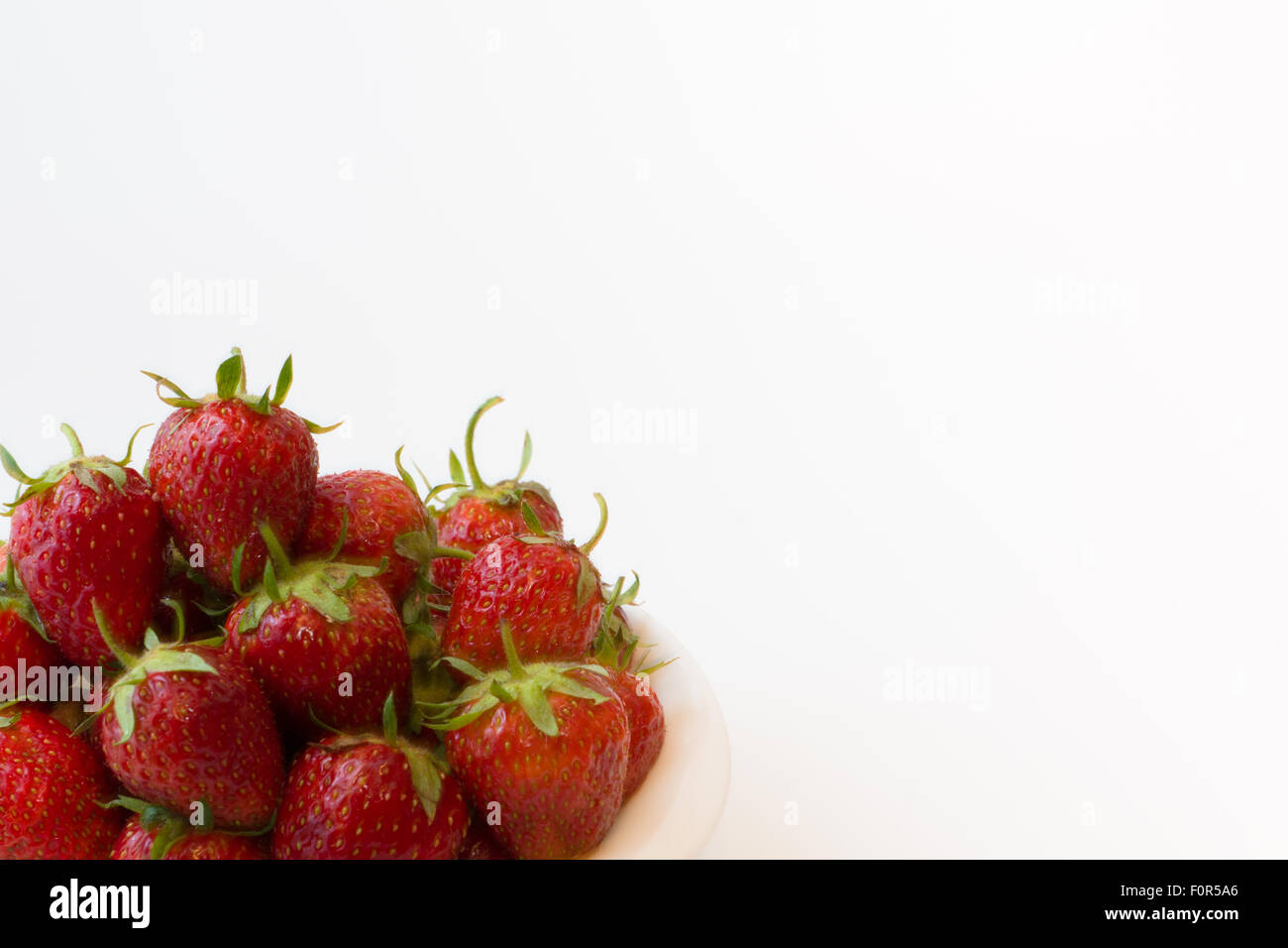 bowl full of ripe juicy strawberry on a white background Stock Photo ...