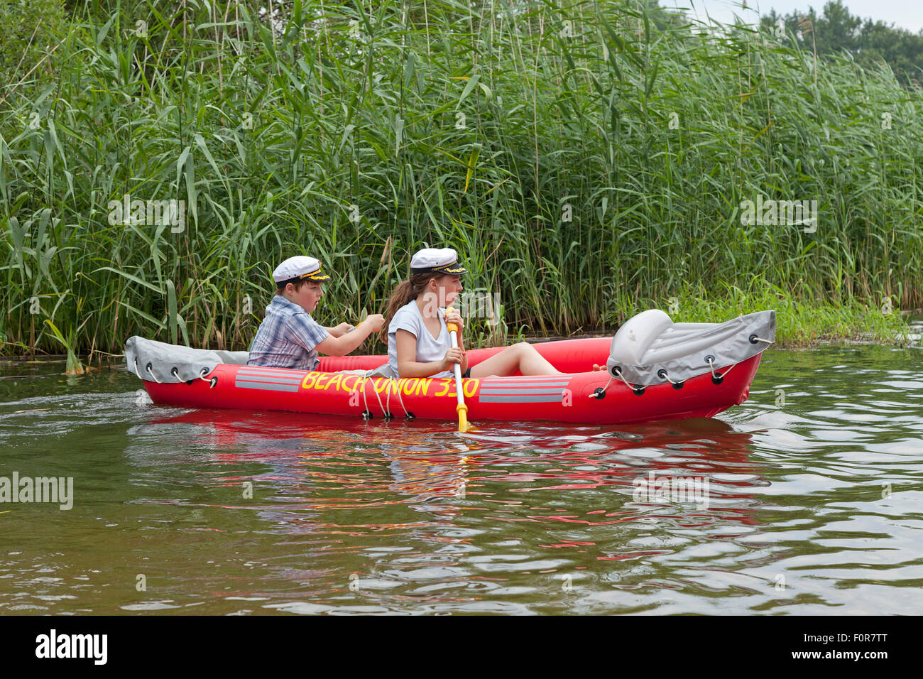 two children in a rubber dinghy Stock Photo Alamy