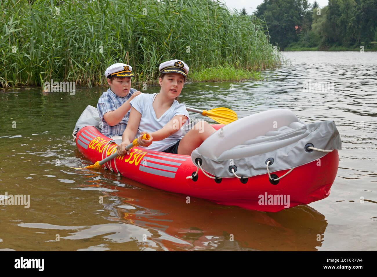 two children in a rubber dinghy Stock Photo Alamy