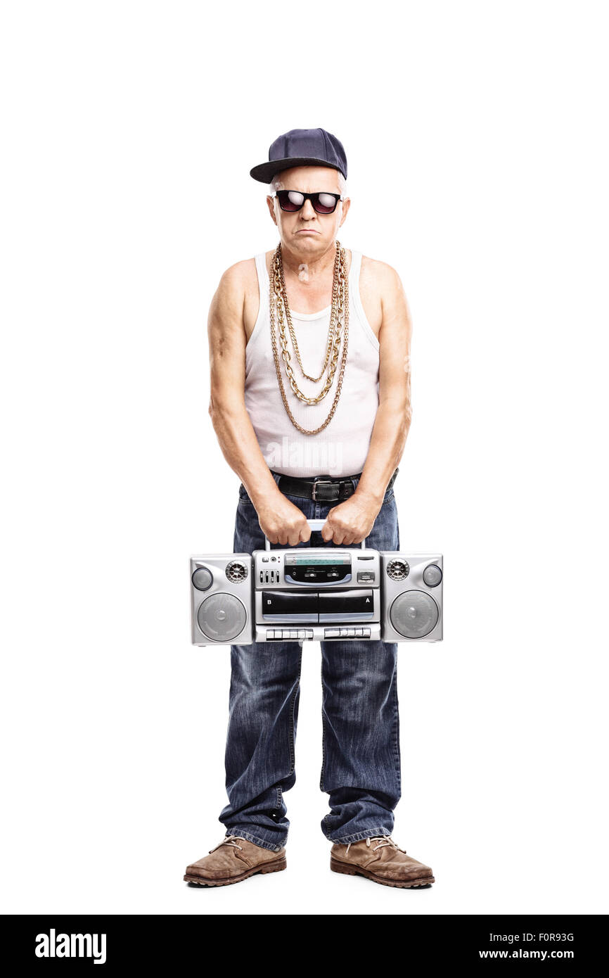 Full length portrait of a hardcore rapper holding a ghetto blaster and looking at the camera isolated on white background Stock Photo