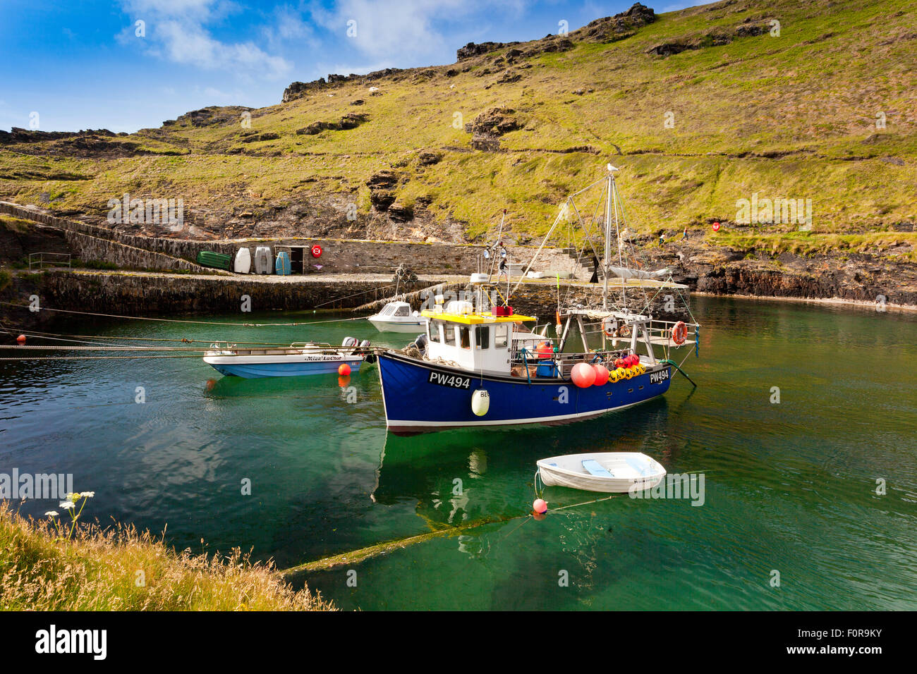 A colourful fishing boat in the harbour at Boscastle, north Cornwall, England, UK Stock Photo