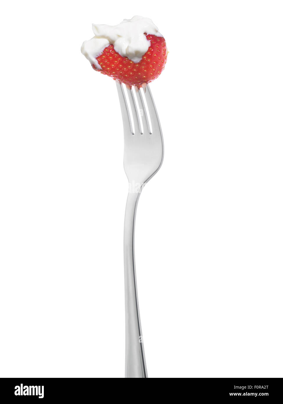 strawberry and cream on fork isolated on white Stock Photo