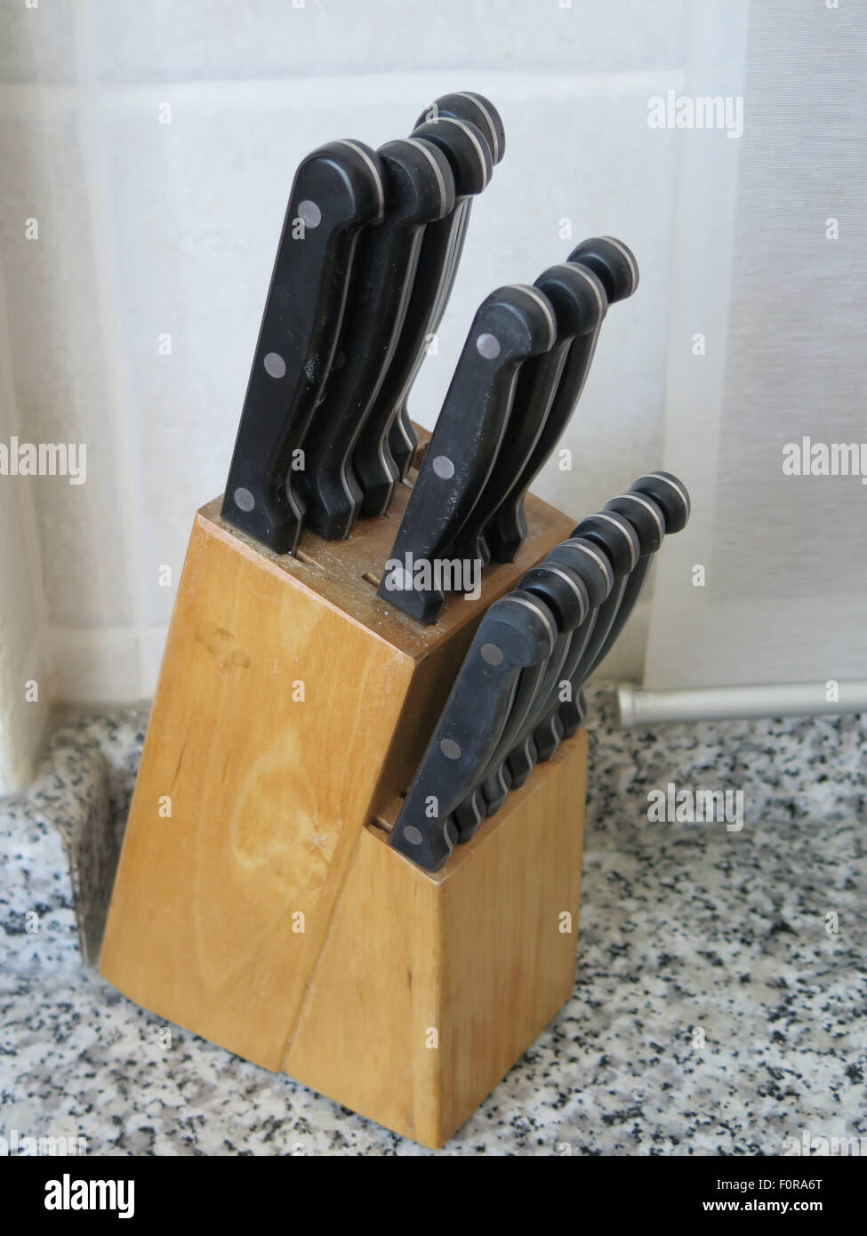 https://c8.alamy.com/comp/F0RA6T/knife-block-on-granite-kitchen-work-top-F0RA6T.jpg