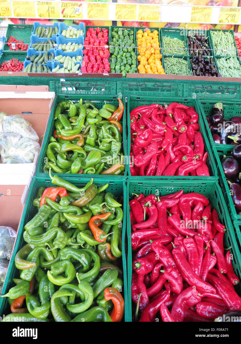 fresh ripe green and red peppers for sale at market stall in Berlin Stock Photo