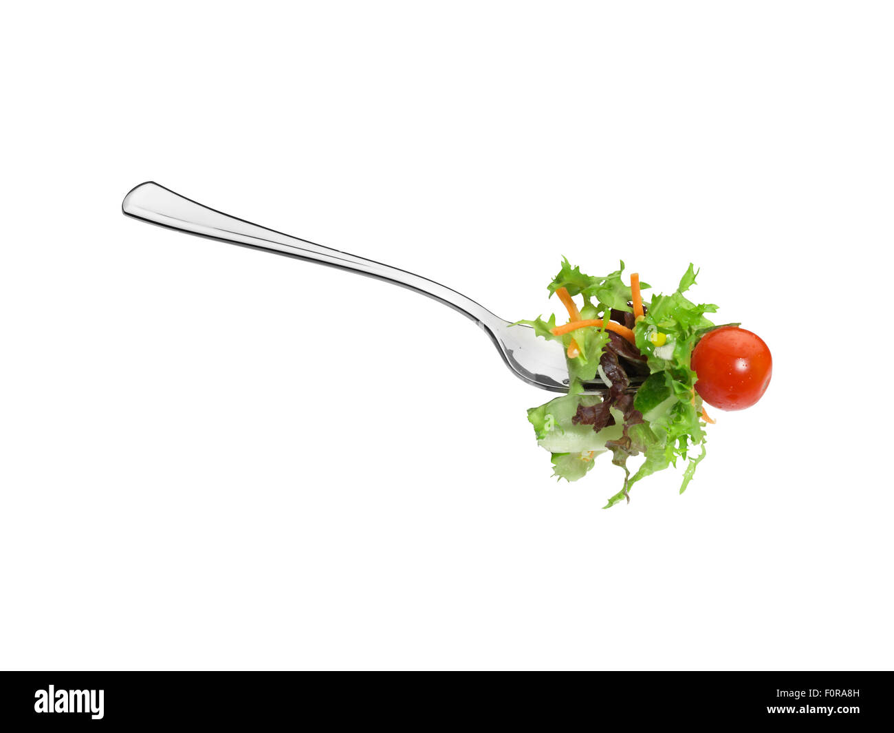 Close-up of salad on a fork, isolated on a white background with clipping Path Stock Photo