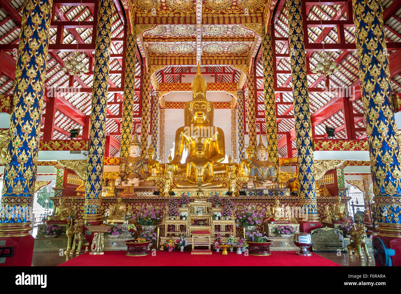 Large golden Buddha statues on the altar at Wat Suan Dok, Chiang Mai