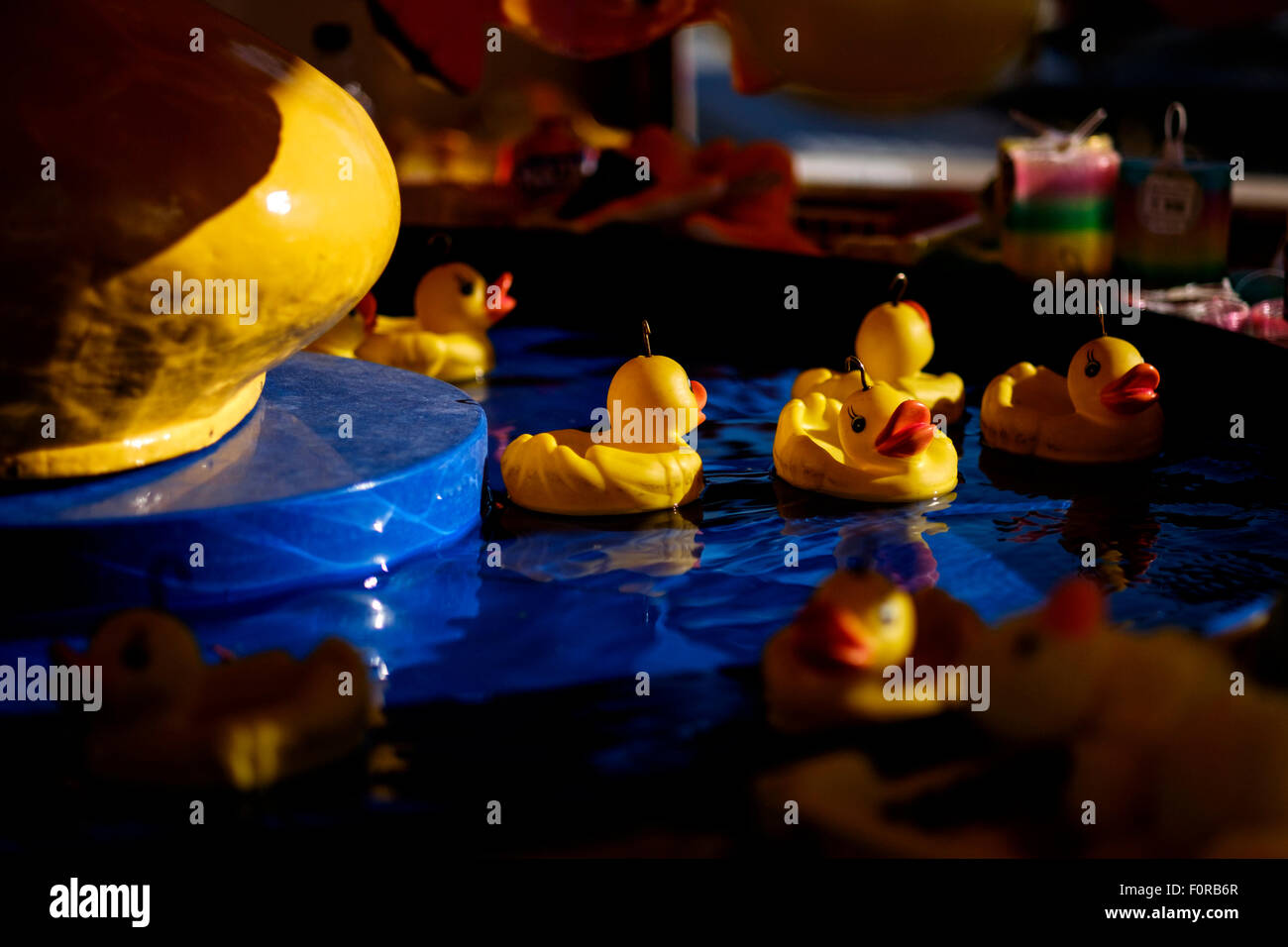 Plastic duck fishing at an amusement park Stock Photo - Alamy