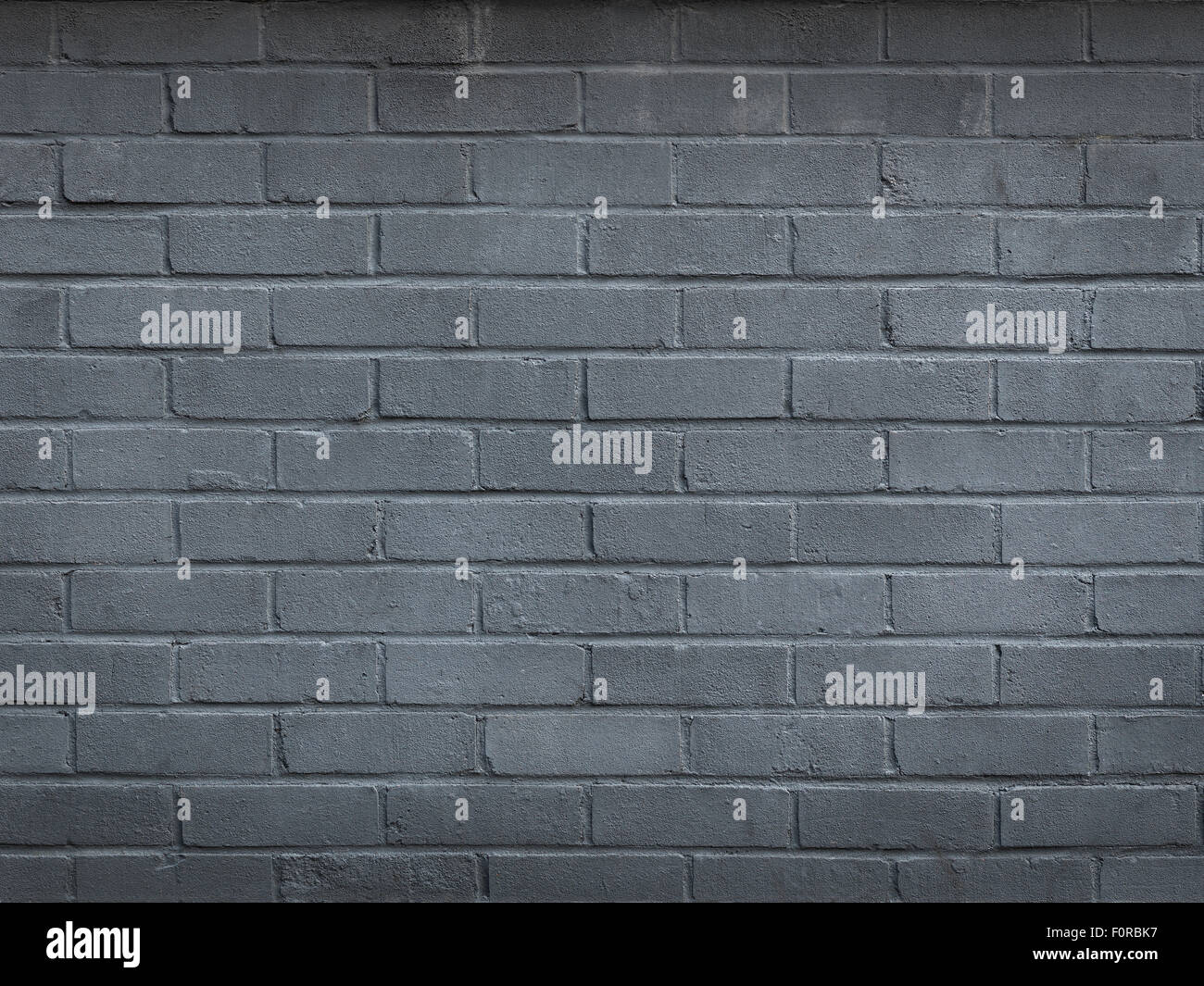 Shot of a brick wall, painted grey, with imperfections left in to add to authenticity with copy space for the designer. Stock Photo