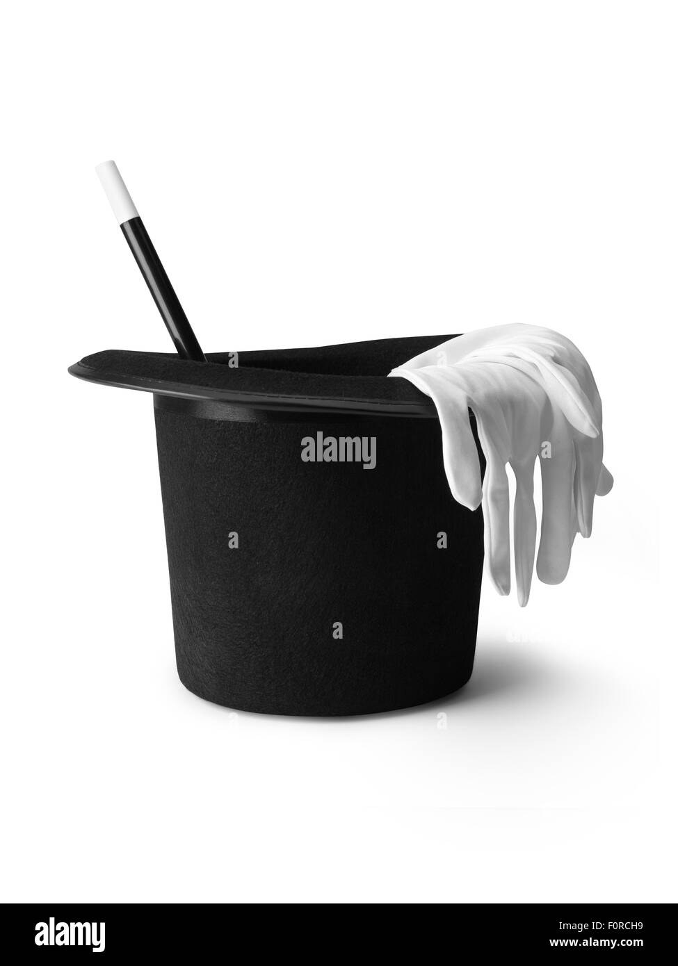 shot of a magicians top hat, gloves and magic wand isolated on a pure white background with a clipping path and copy space. Stock Photo