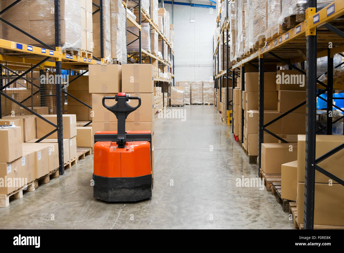 industrial warehouse interior and pallets with cardboard cartons Stock Photo