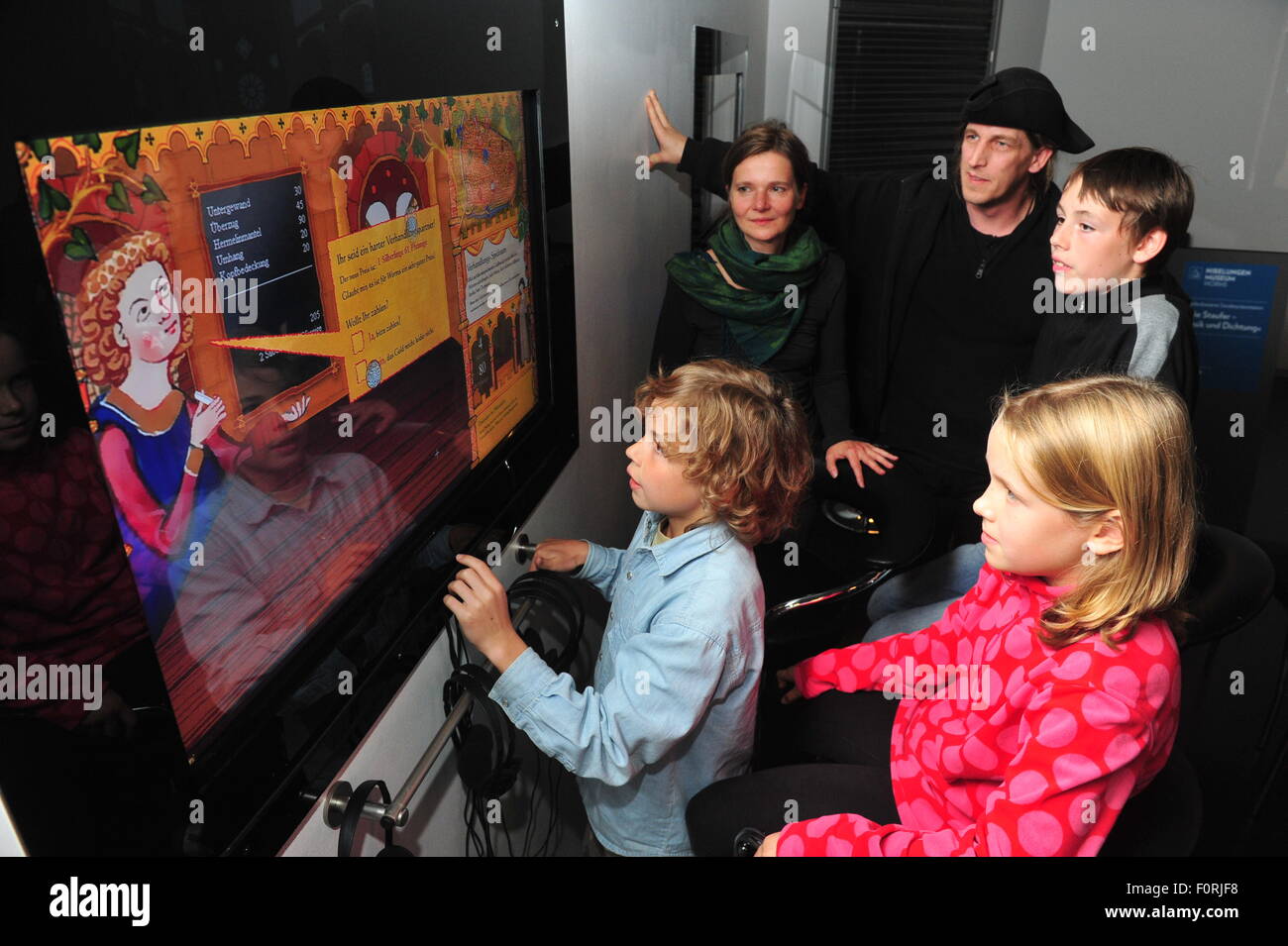 Worms, Germany - Septemer 7, 2010 - Children touching screen in Museum of Nibelungen for education and learning Stock Photo